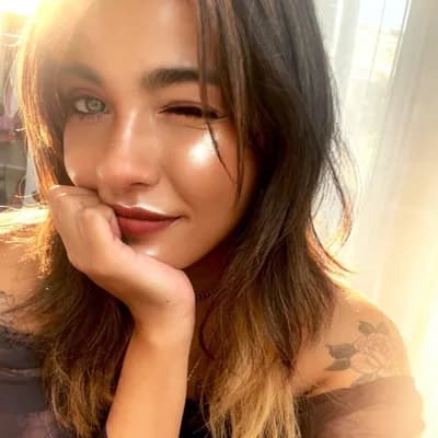 AI generated video: create a cute and flirty video, winking, smiling in a shy way