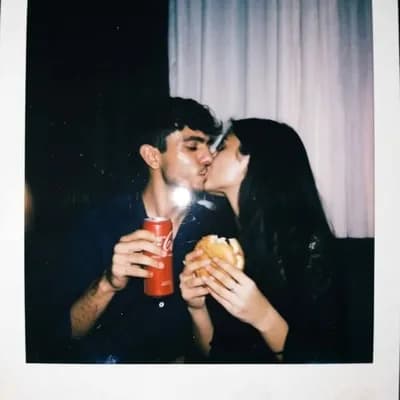 AI generated video: Wife initially standing close to her husband then slowly kisses her husband then walks away from him...