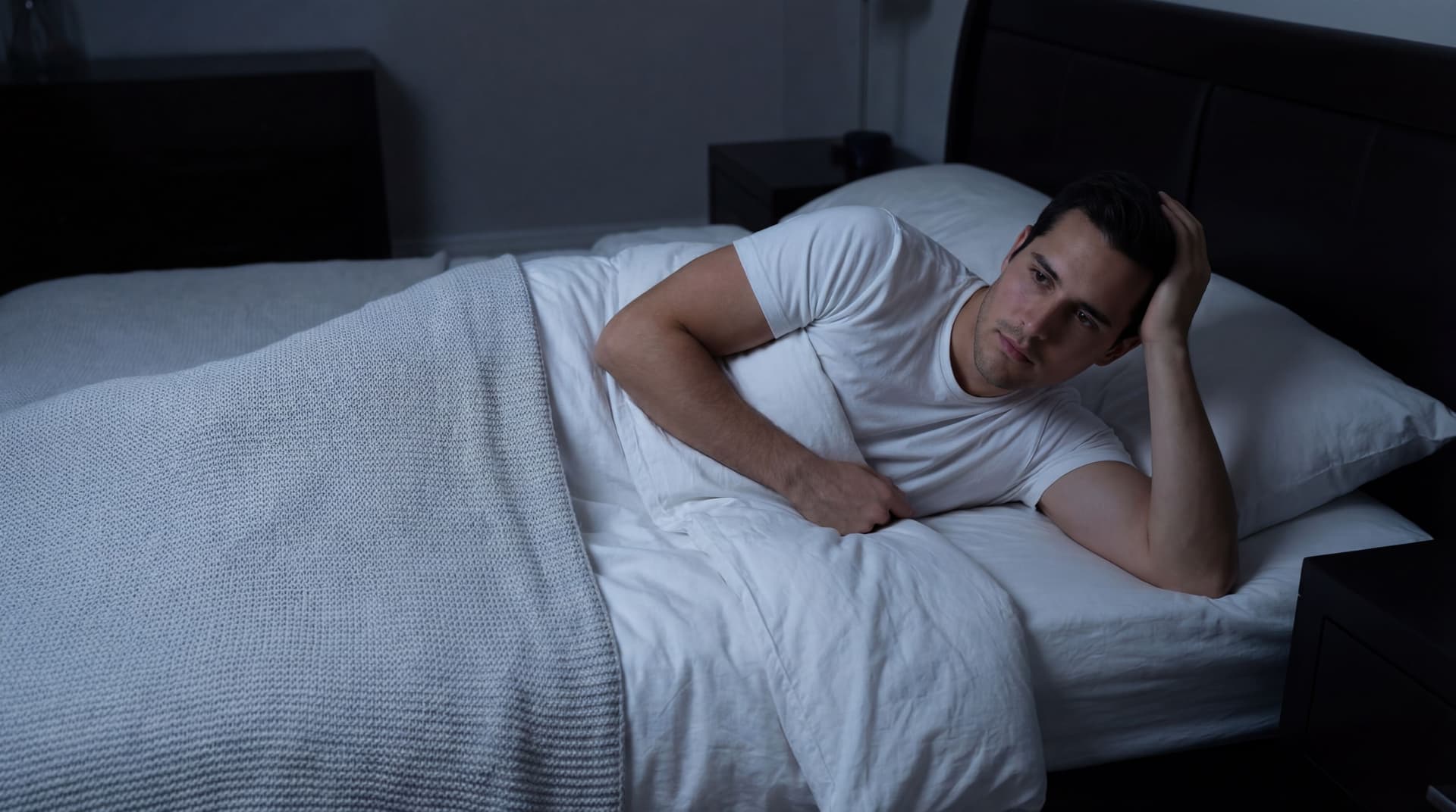 AI generated: At a very nice large bedroom at night. there are no windows. The lights are off. the Hispanic guy ha...