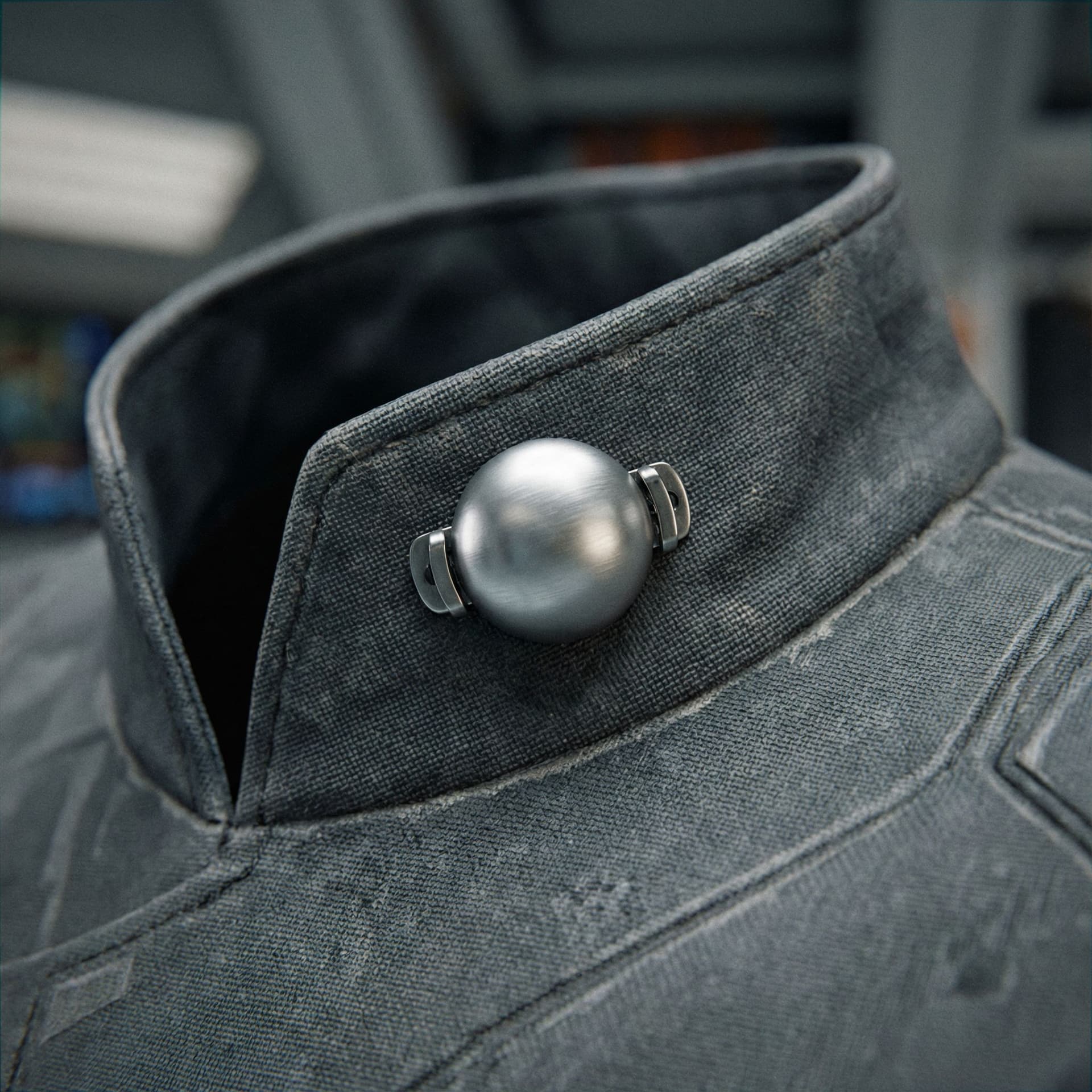 AI generated: Create a Sci-Fi rank insignia to pin on the collar of a uniform. A single silver dot. 