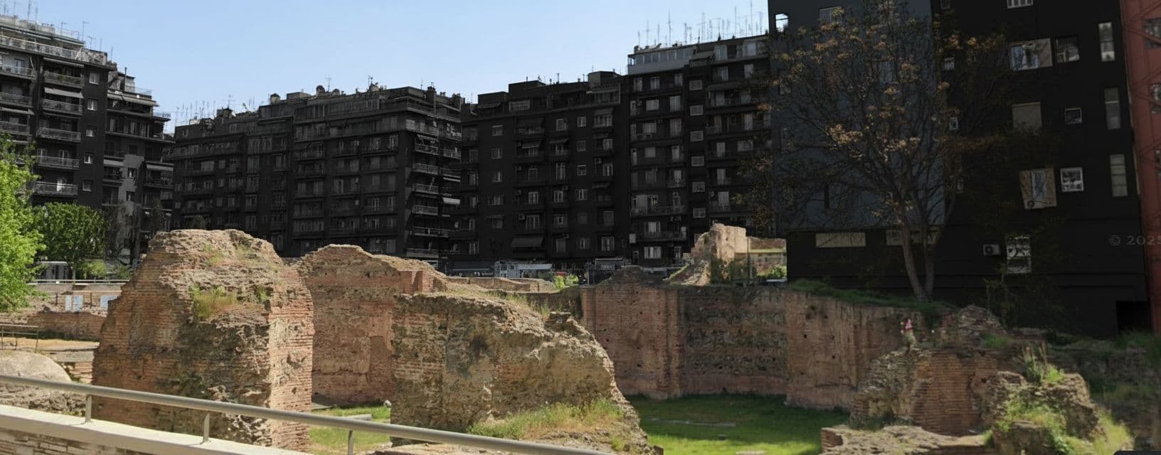 AI generated: Make the colour of the buildings surrounding the image black (except the ancient ruins)