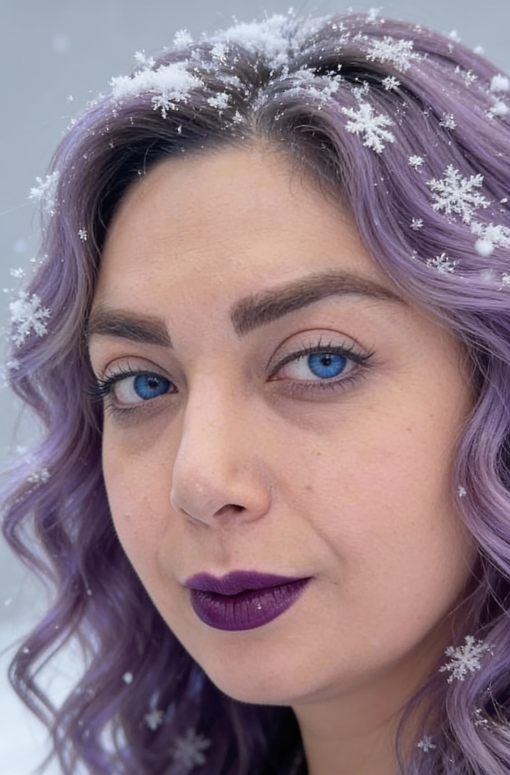 AI generated: A close-up portrait of a person with wavy, lavender purple hair dusted with snowflakes, piercing blu...