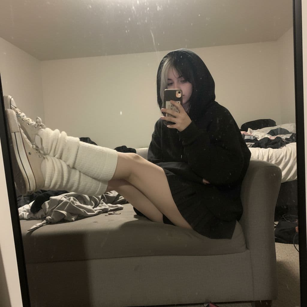 AI generated: An extremely unremarkable iPhone mirror selfie photo with no clear subject or framing—just a careles...