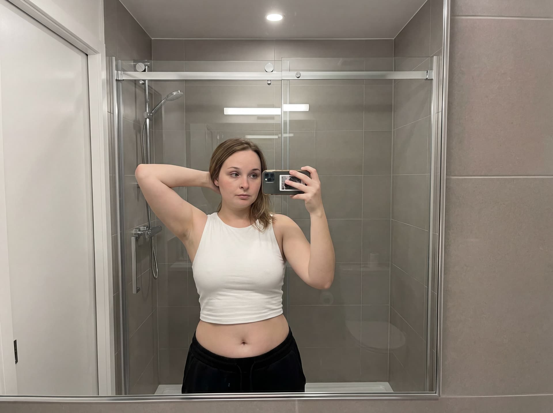 AI generated: { "action": "image_generation", "action_input": "A high-fidelity, photorealistic mirror selfie of th...
