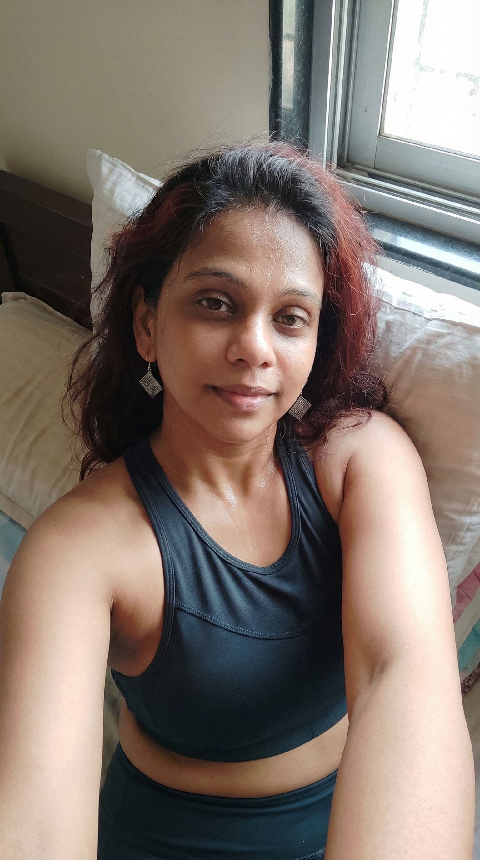 AI generated: An image of her in bed wearing a two piece and maybe a little sweat