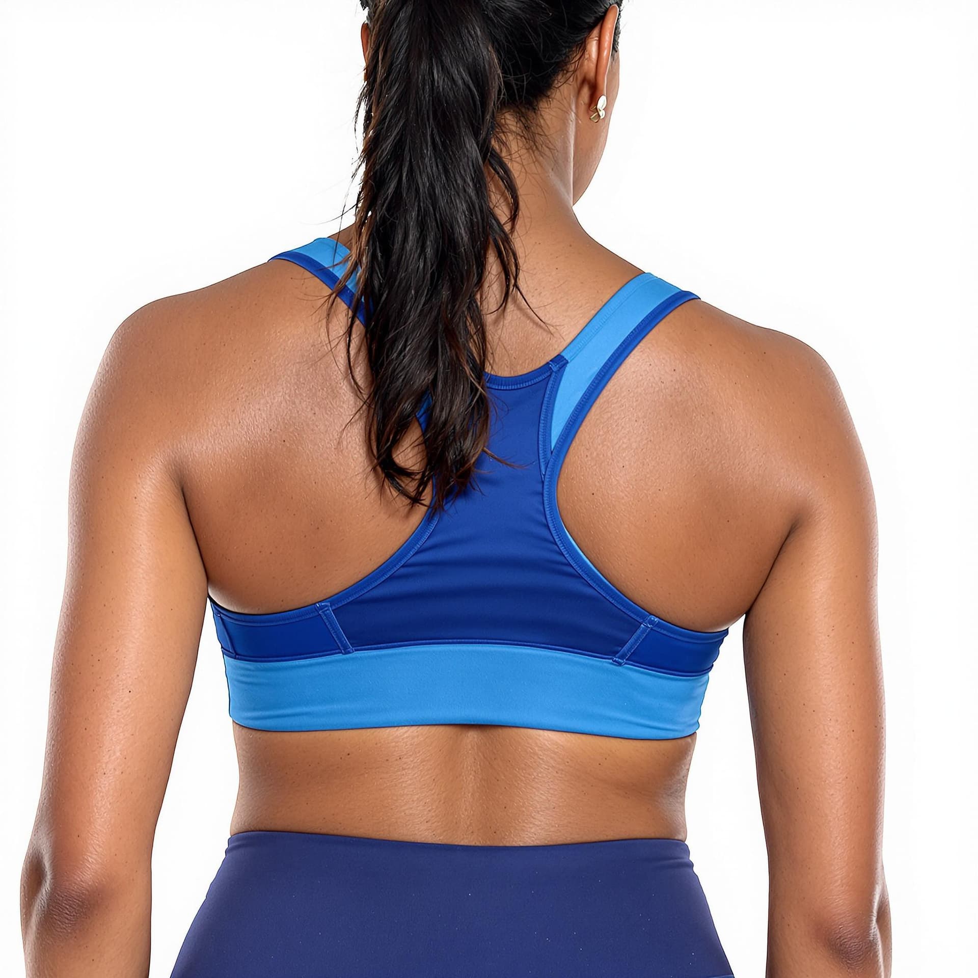 AI generated: a  black woman wearing blue sports bra and matching leggings. Her hair is pulled back in a ponytail....