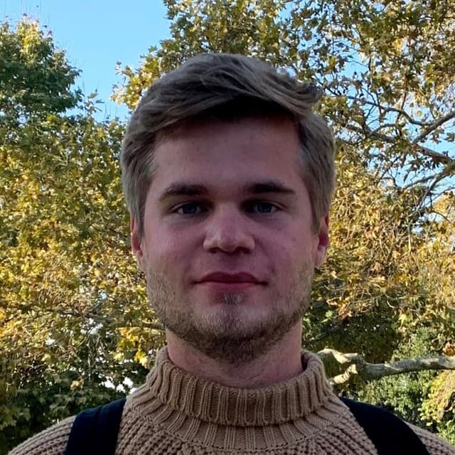 AI generated: Ultra-realistic 4K image of a young man in a brown turtleneck with an expressive facial expression w...