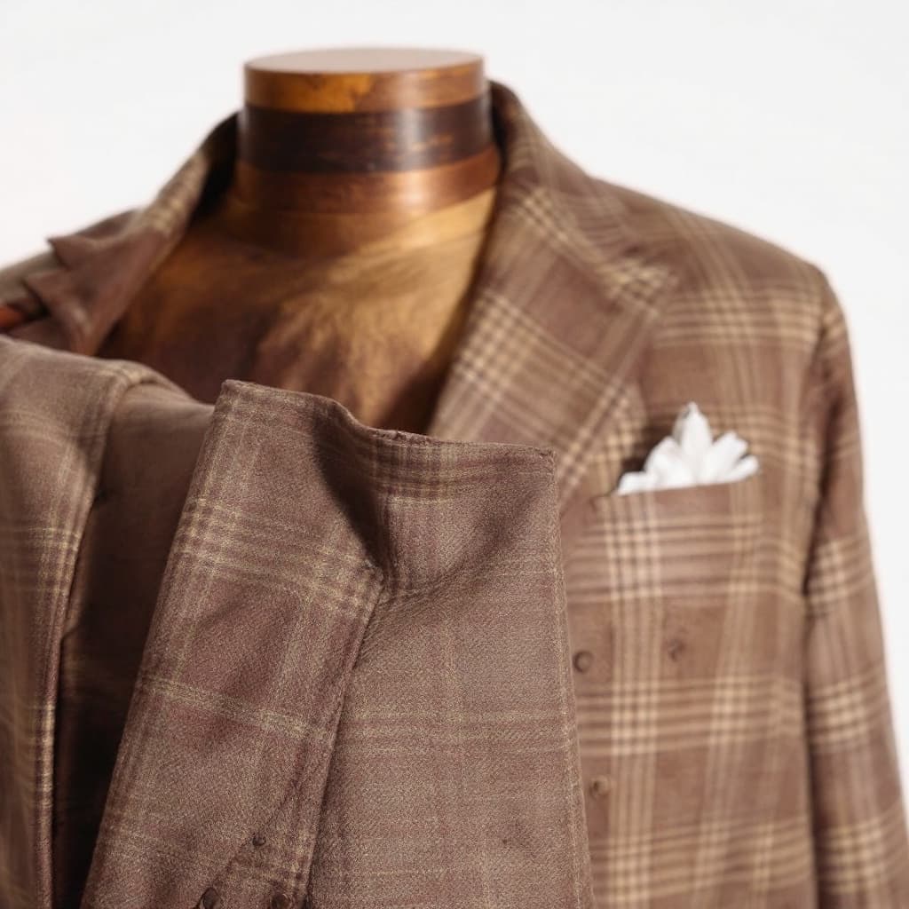 AI generated: A man wearing a brown and beige patterned suit, with a subtle plaid texture, against a plain white b...