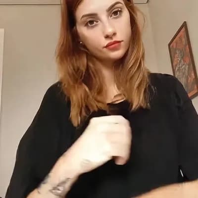AI generated video: she  removes her clothes instantly and is completely topless naked and reveals her big saggy breasts...