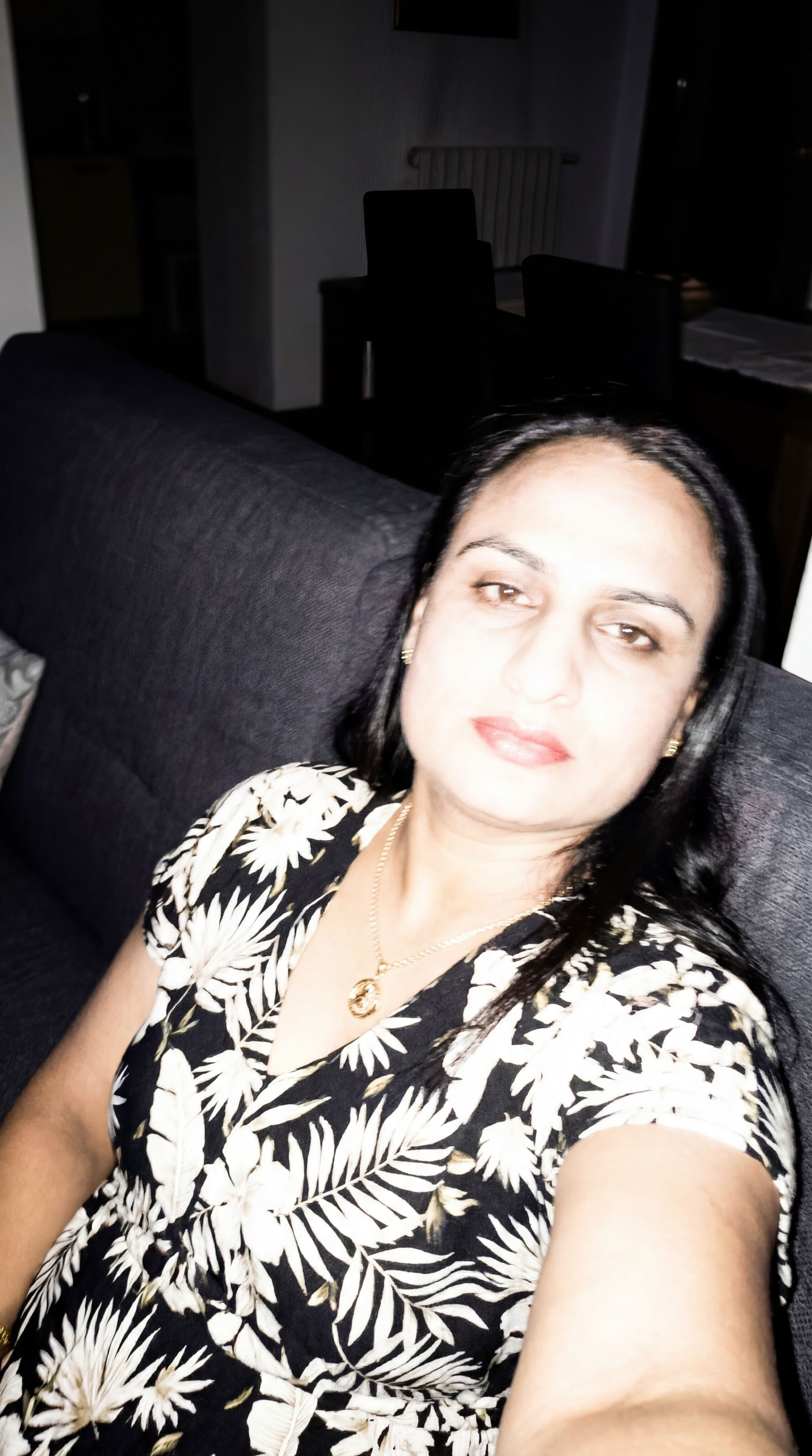 AI generated: Using the uploaded reference photo, create a standard iPhone selfie with flash. There's no clear sub...