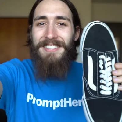 AI generated video: selfie shot of a longbearded young thin man wearing a blue tshirt with the white text "PromptHero" h...