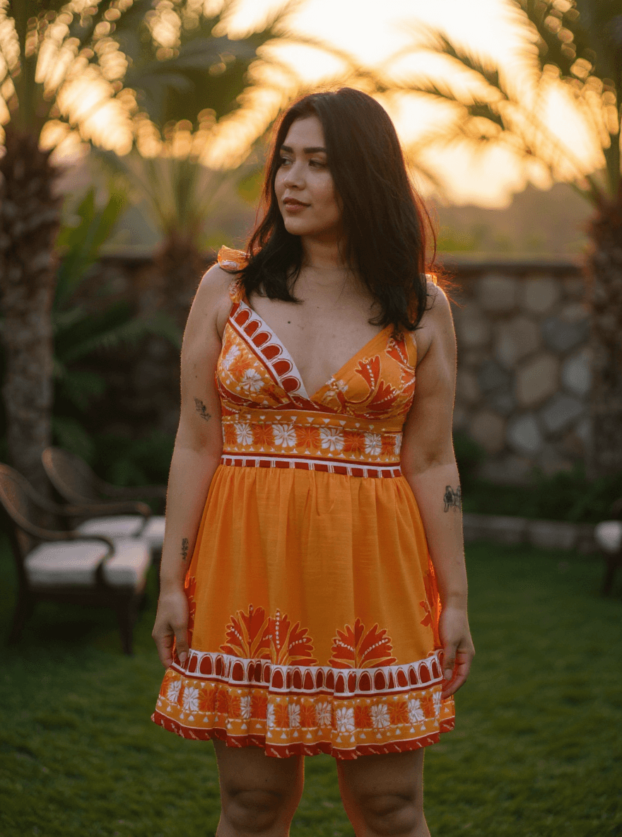 AI generated: A beautiful Brazilian woman wearing a short, orange tropical dress with vibrant floral patterns, ins...