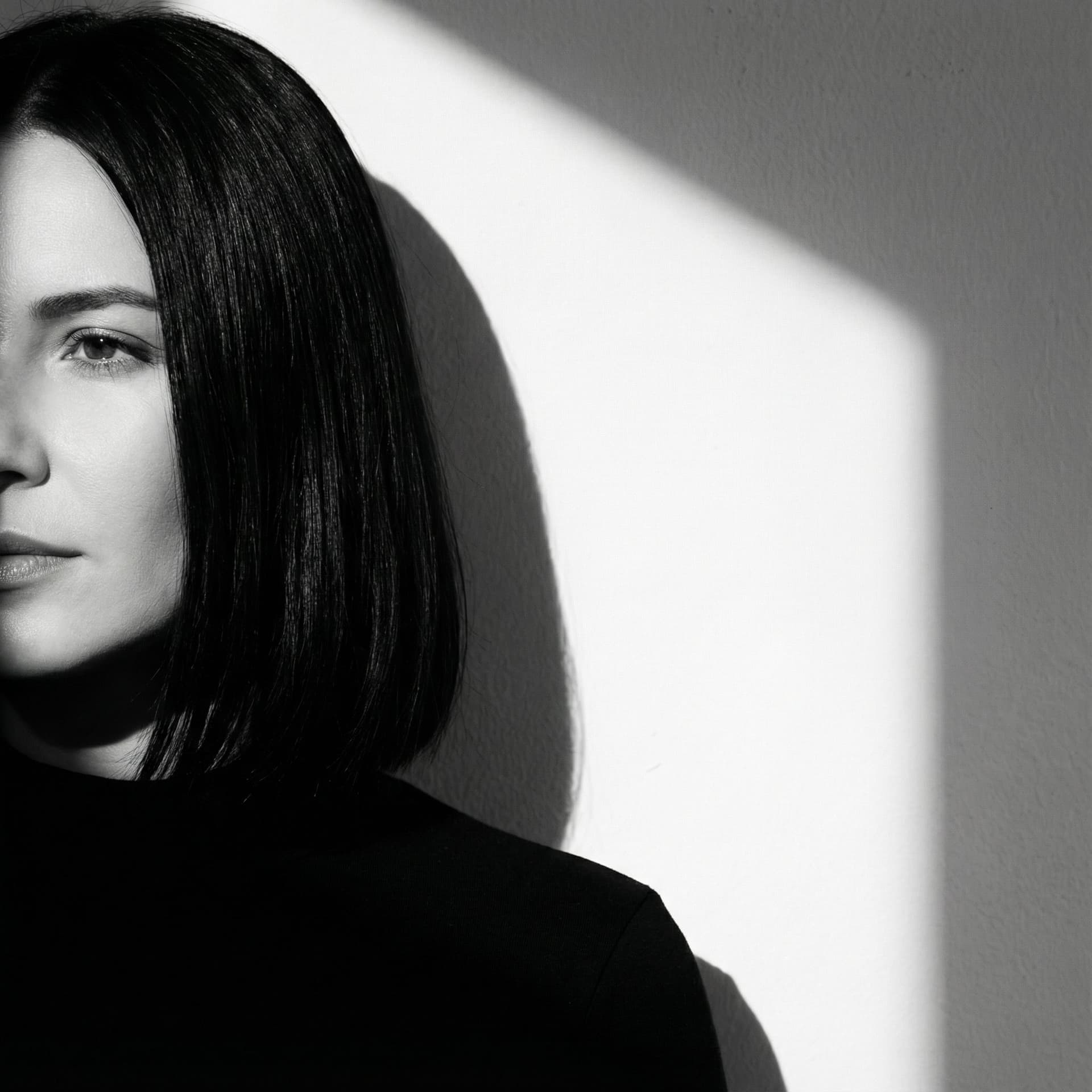 AI generated: a black and white photo of a woman with shadow., in the style of minimalist beauty, light bronze and...