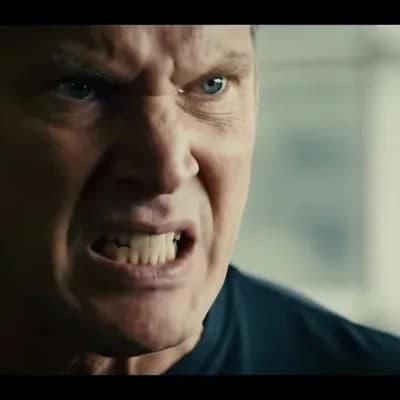 AI generated video: The camera focuses on his angry look from the front angle.
