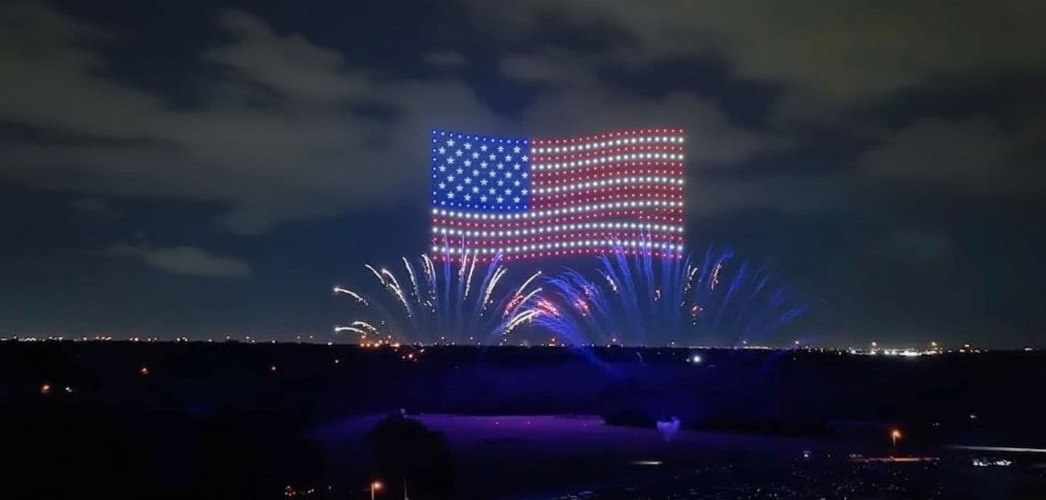 AI generated: 4K, photorealistic image of a 4th of July drone show with the drones in the formation of a huge Amer...