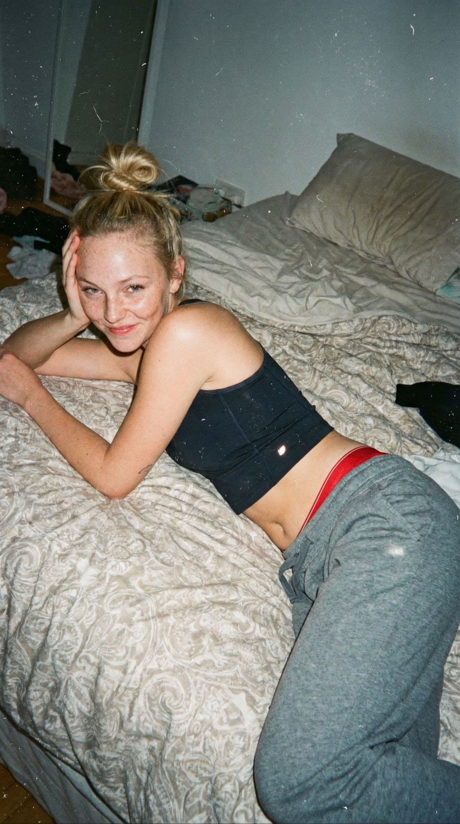 AI generated: Raw lo-fi analog snapshot, early-2000s aesthetic, flash-lit with dust and scratches on the frame.  ...
