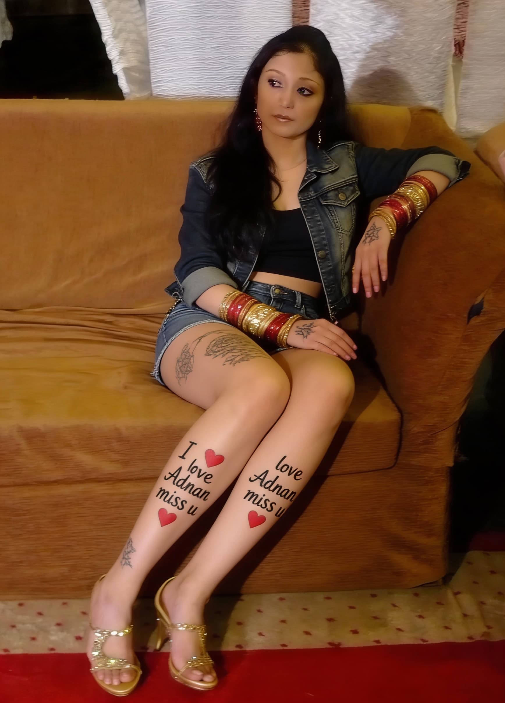AI generated: Dress change to western and tattoo legs and hands write in I love Adnan miss u and red hearts