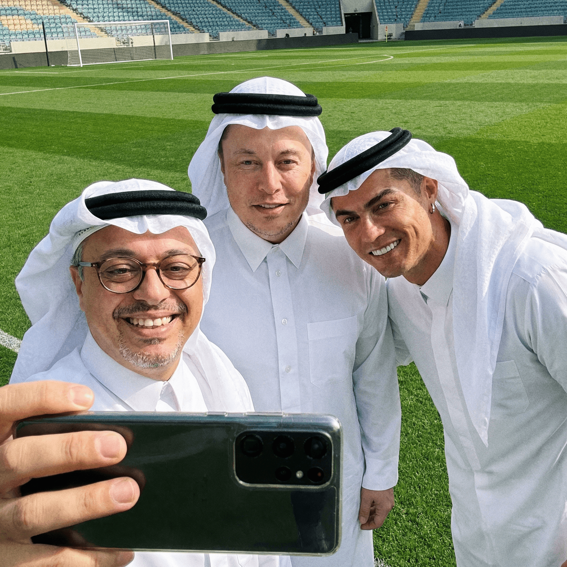 AI generated: with Elon Musk and Cristiano Ronaldo, in Arab dress,  on soccer pitch