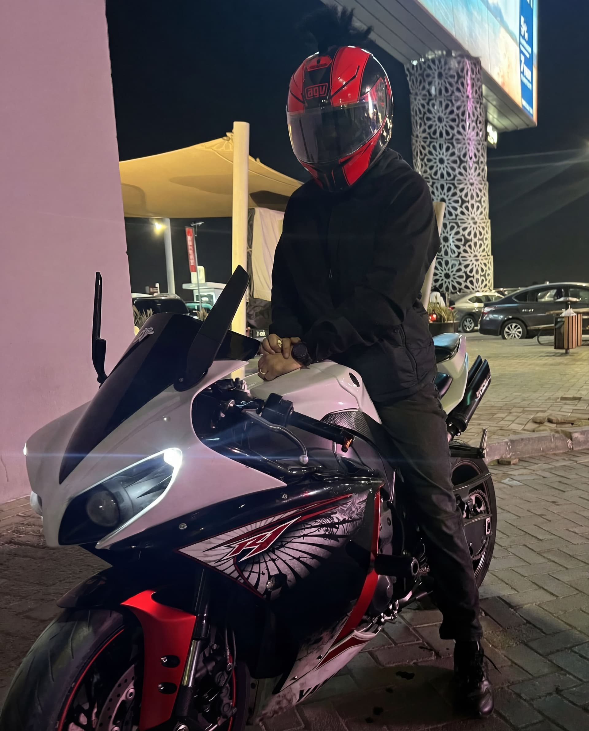 AI generated: Change the helmets to be the biker wearing the red helmet