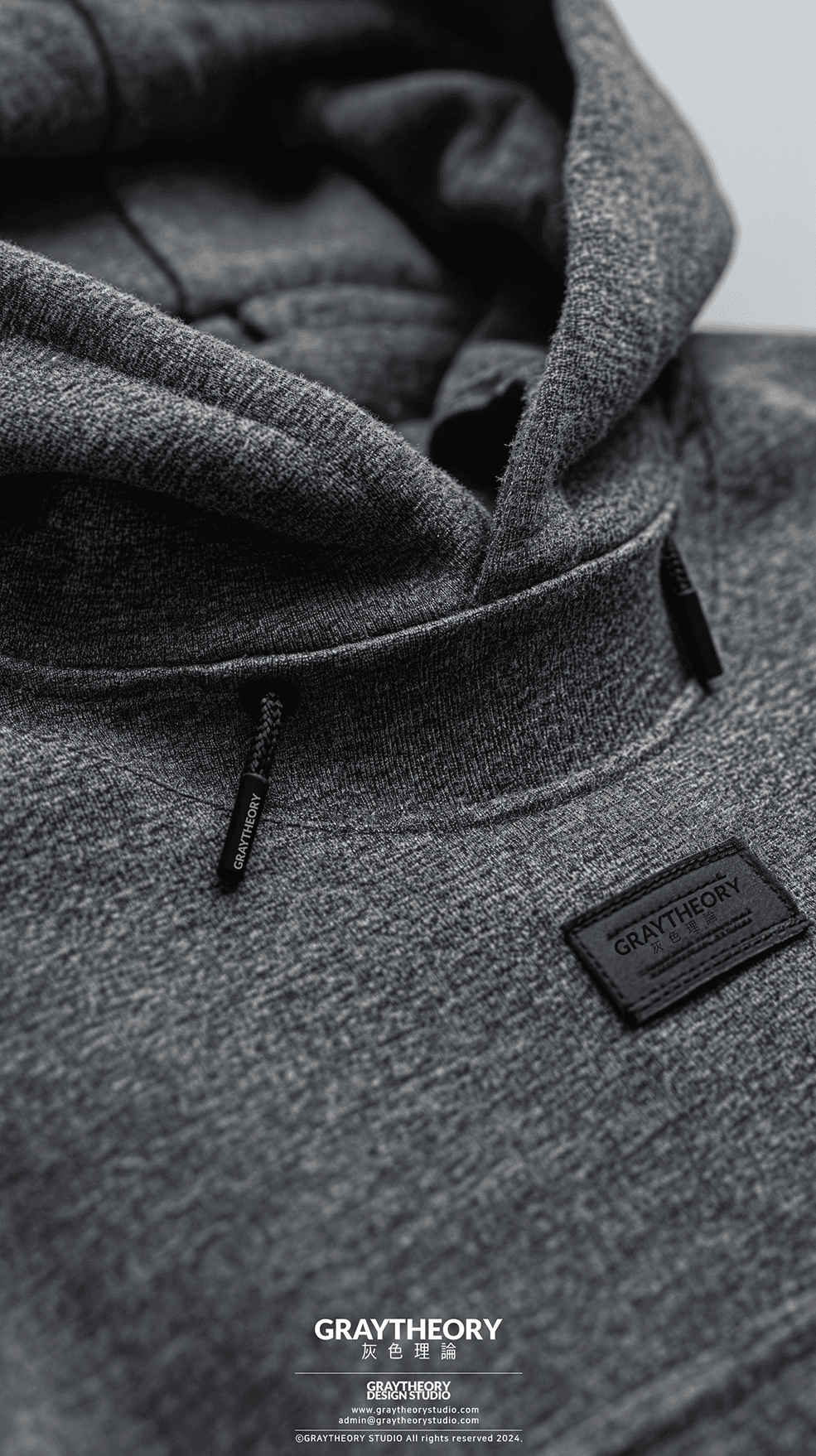 AI generated: front view, capture a hoodie, black, technical materials, fabric label on text 'Graytheory', the des...