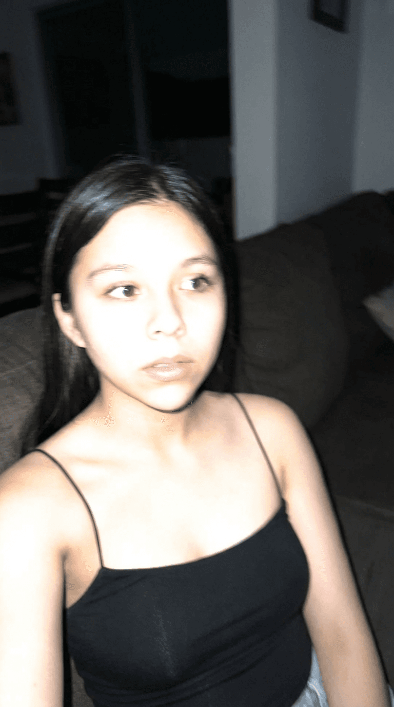 AI generated: Using the uploaded reference photo, create a standard iPhone selfie with flash. There's no clear sub...