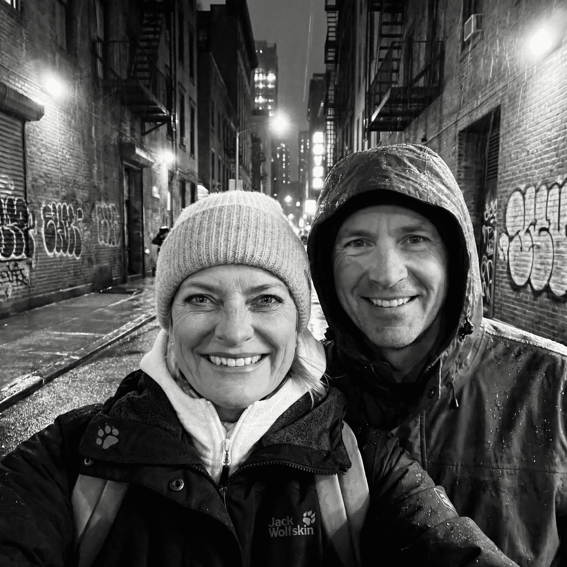 AI generated: black and white selfie in a dark and rainy new york backstreet 
