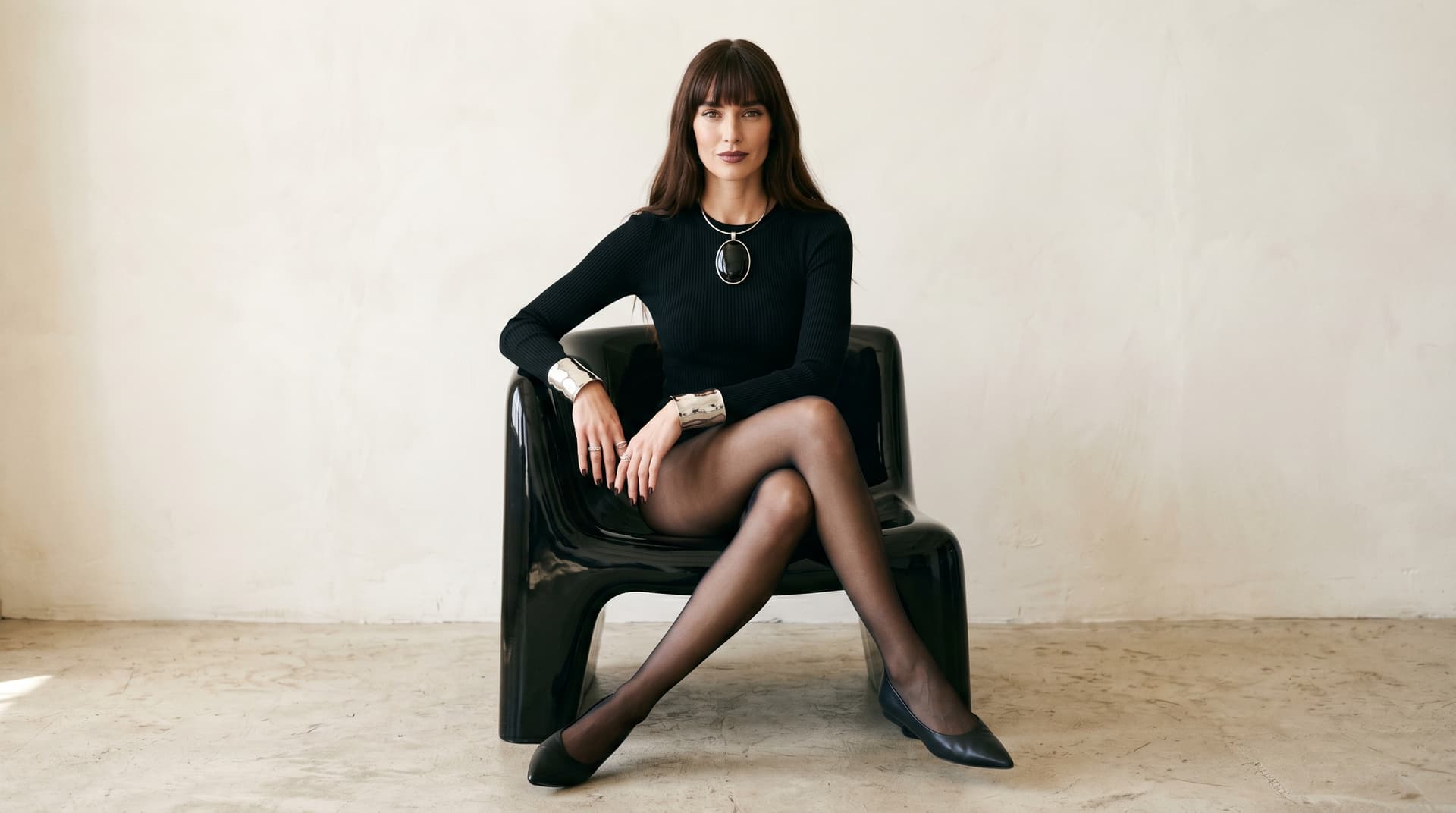 AI generated: (Nano Banana 2) Full-length editorial fashion photograph of a woman with long dark hair and straight...