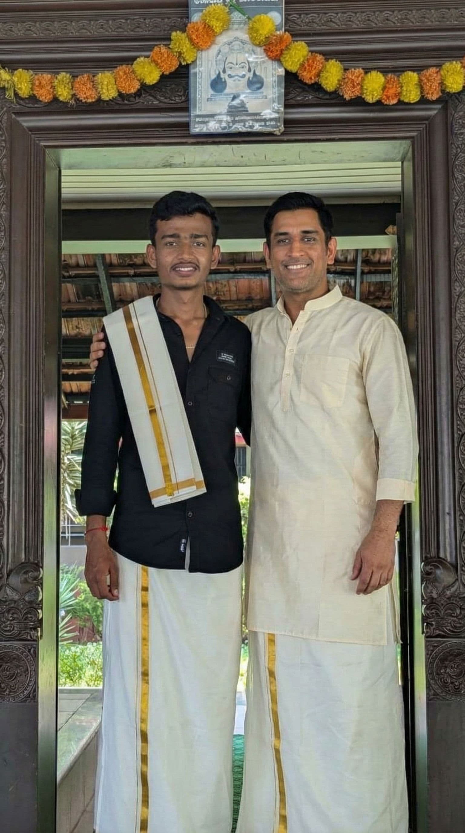 AI generated: Add an image of MS dhoni standing next me and posing for picture