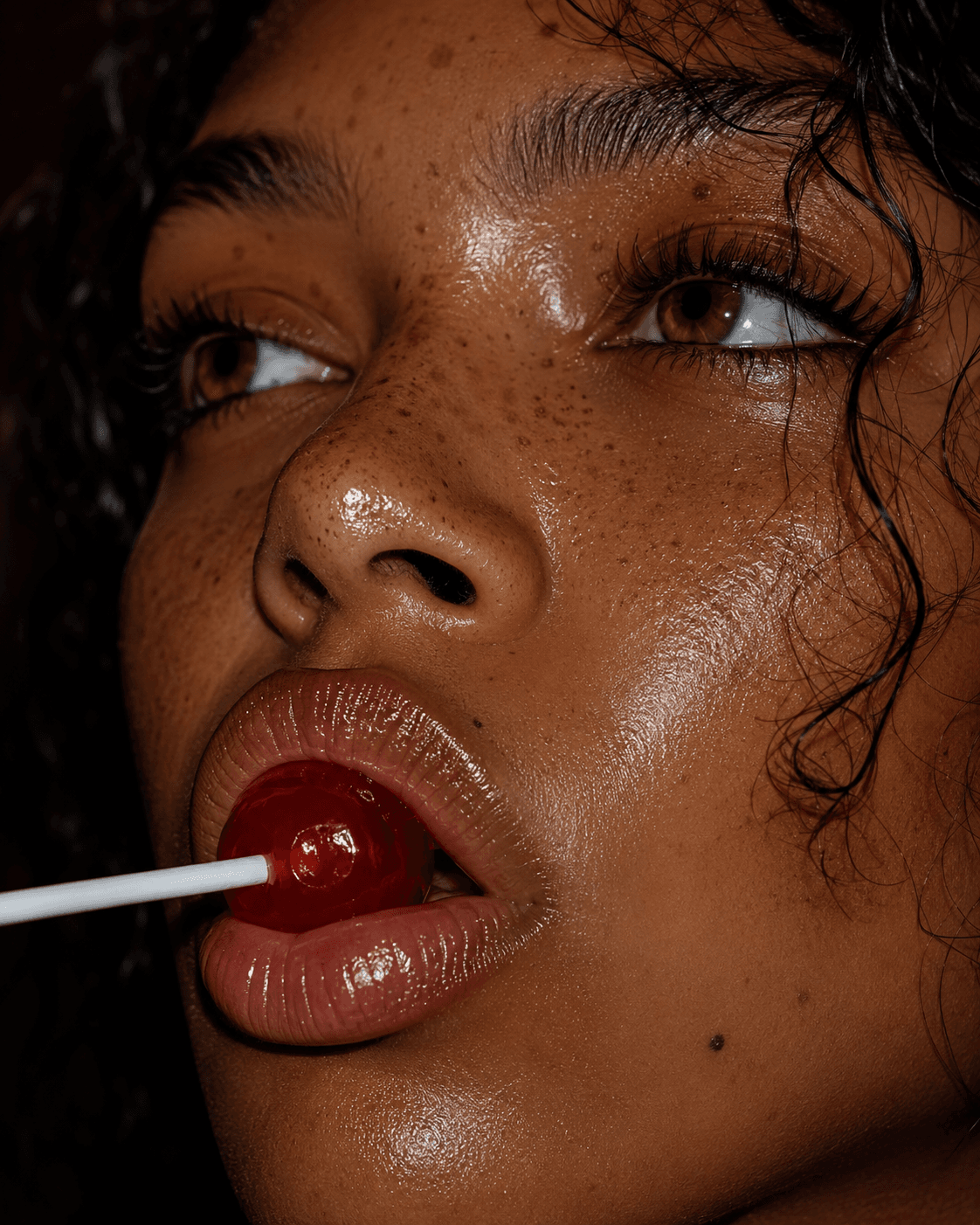 AI generated: Extreme close-up macro portrait of a stunning young woman with warm honey-brown eyes looking upwards...
