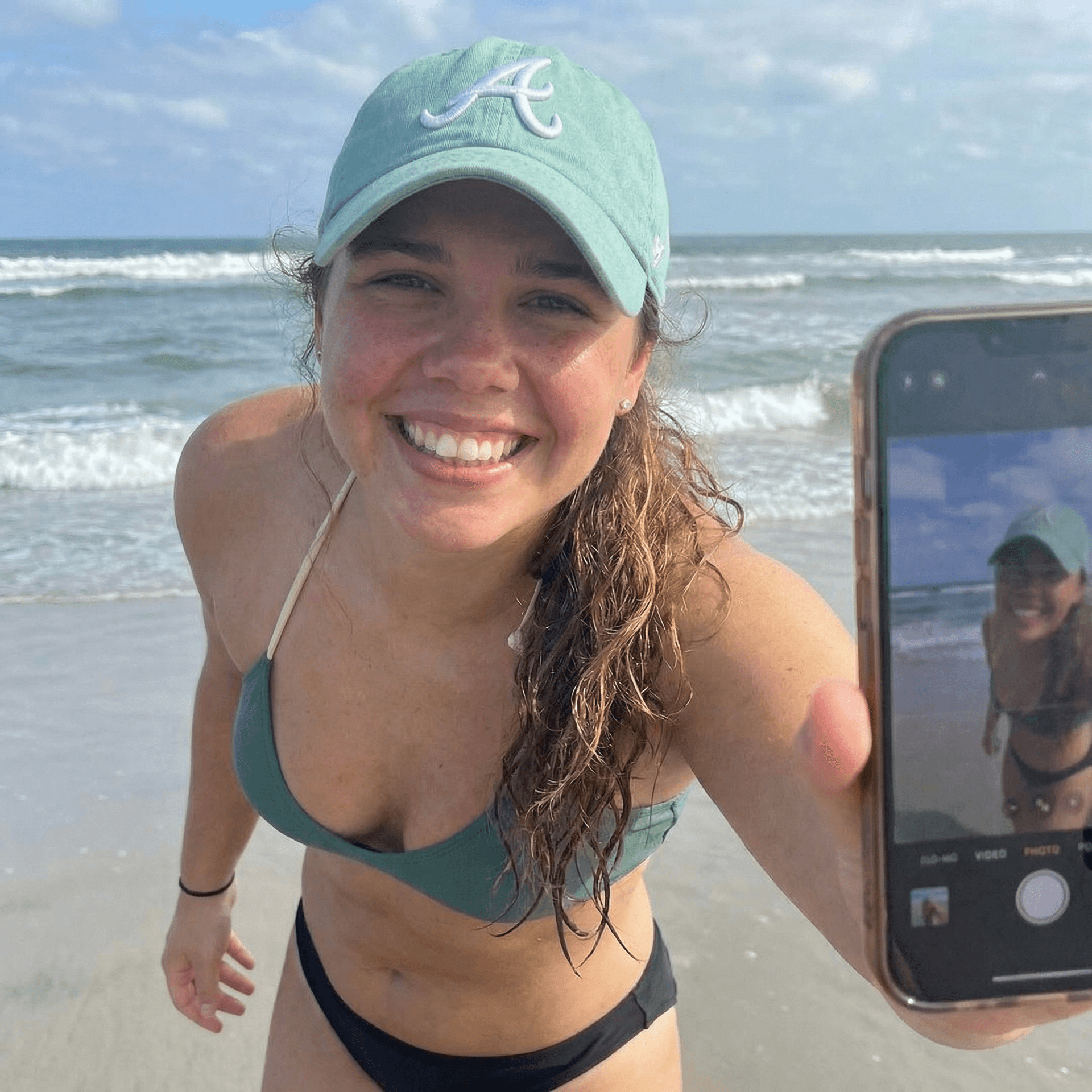 AI generated: Woman in the photo takes a selfie alone with the same smile, only her in the photo 