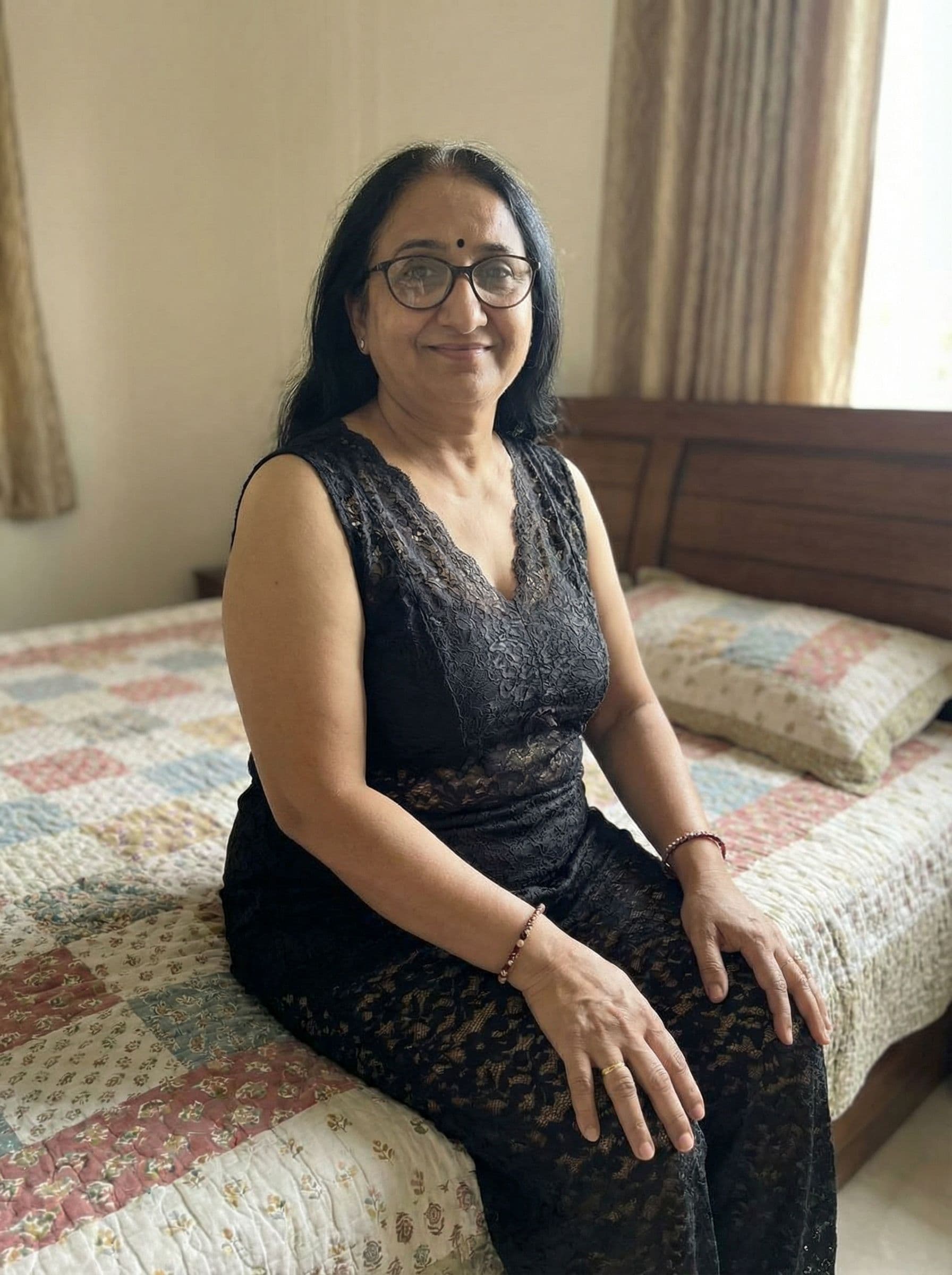 AI generated: Indian women wearing black lace sleeveless night suit sitting on bed 