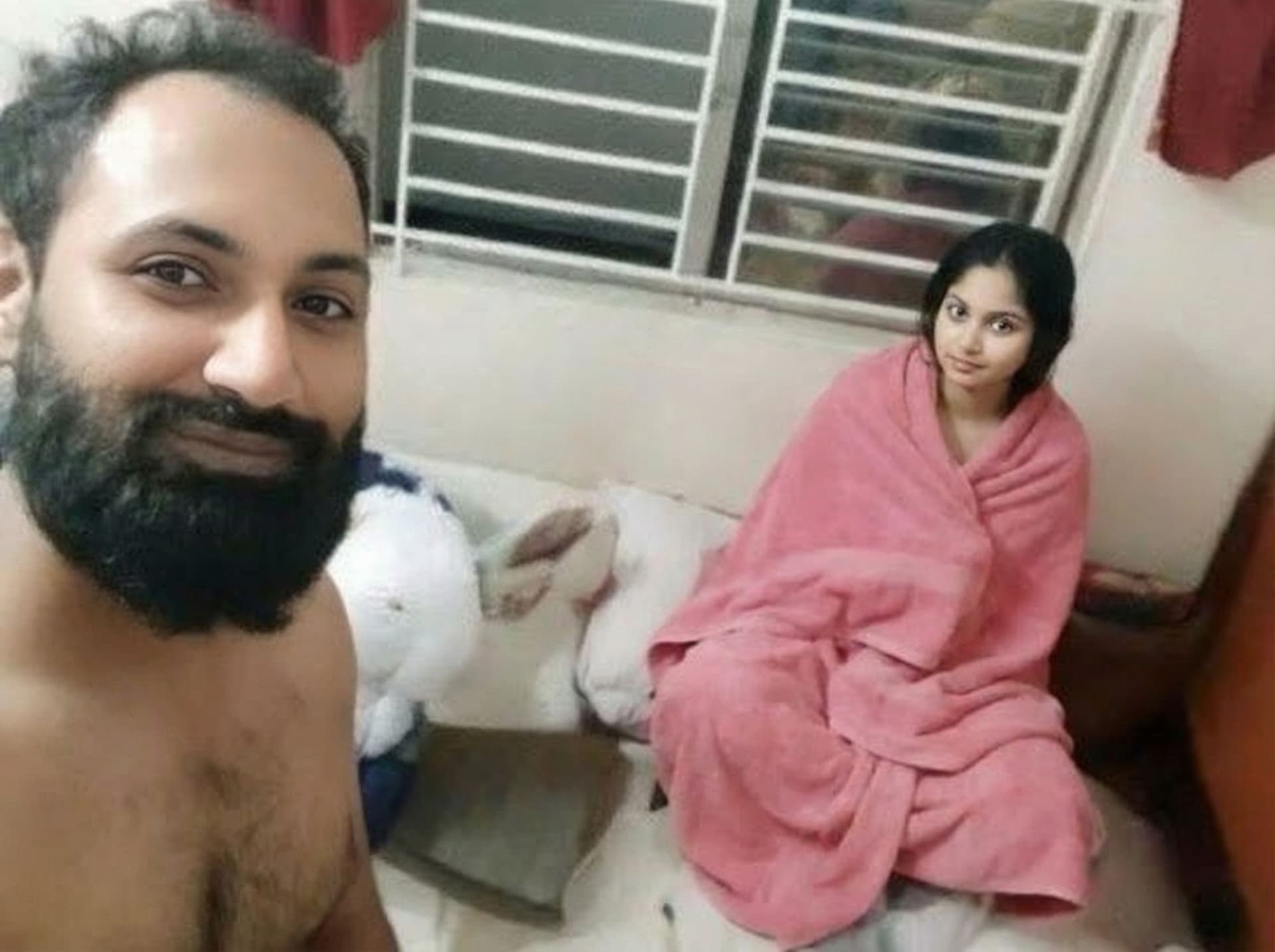 AI generated: Boy nude and girl in pink towel