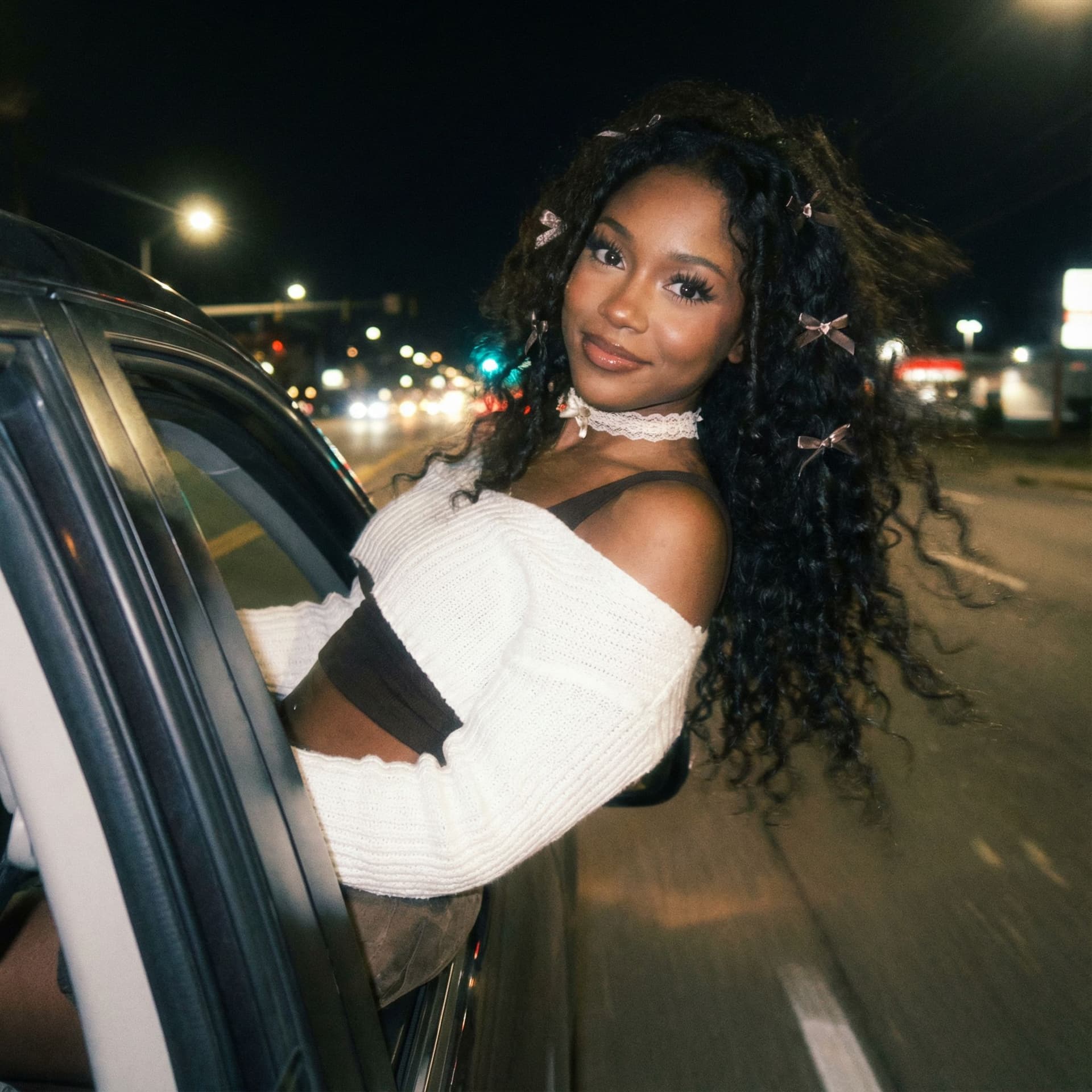 AI generated: Create a ccolor photo of me leaning my back out the window car like a dark dreamy blurry vintage win...
