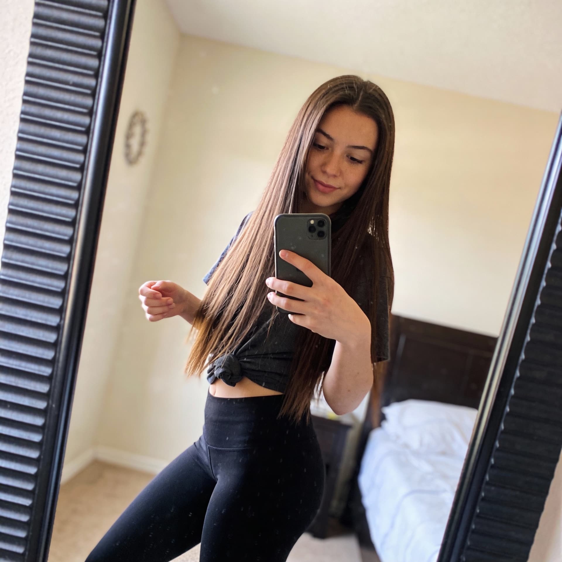 AI generated: the girl takes a photo with her phone of herself in the mirror, she has 24 years old, has straight b...