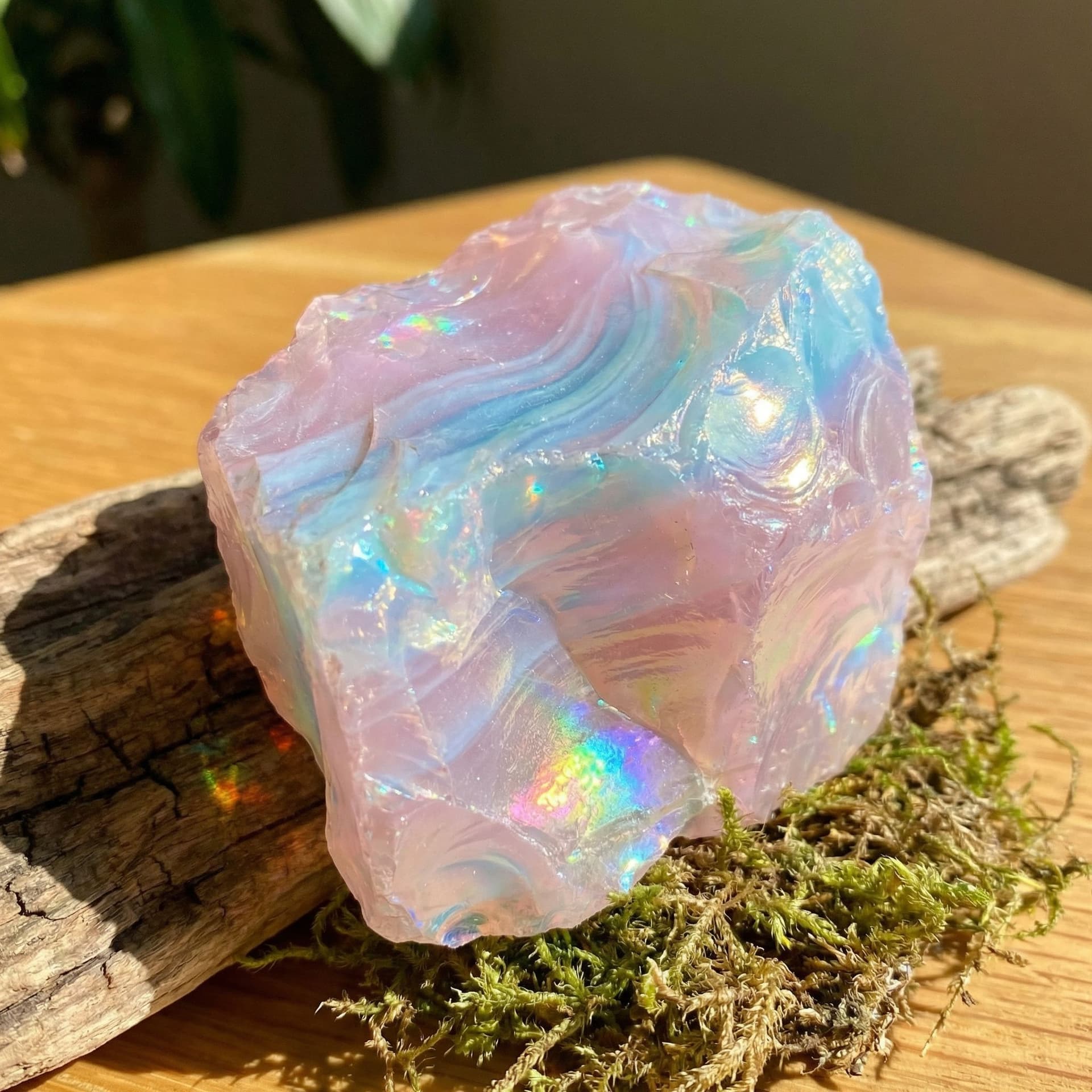 AI generated: A light pink crystal with light blues mixed in that gives it an opal feel and shines like one too 