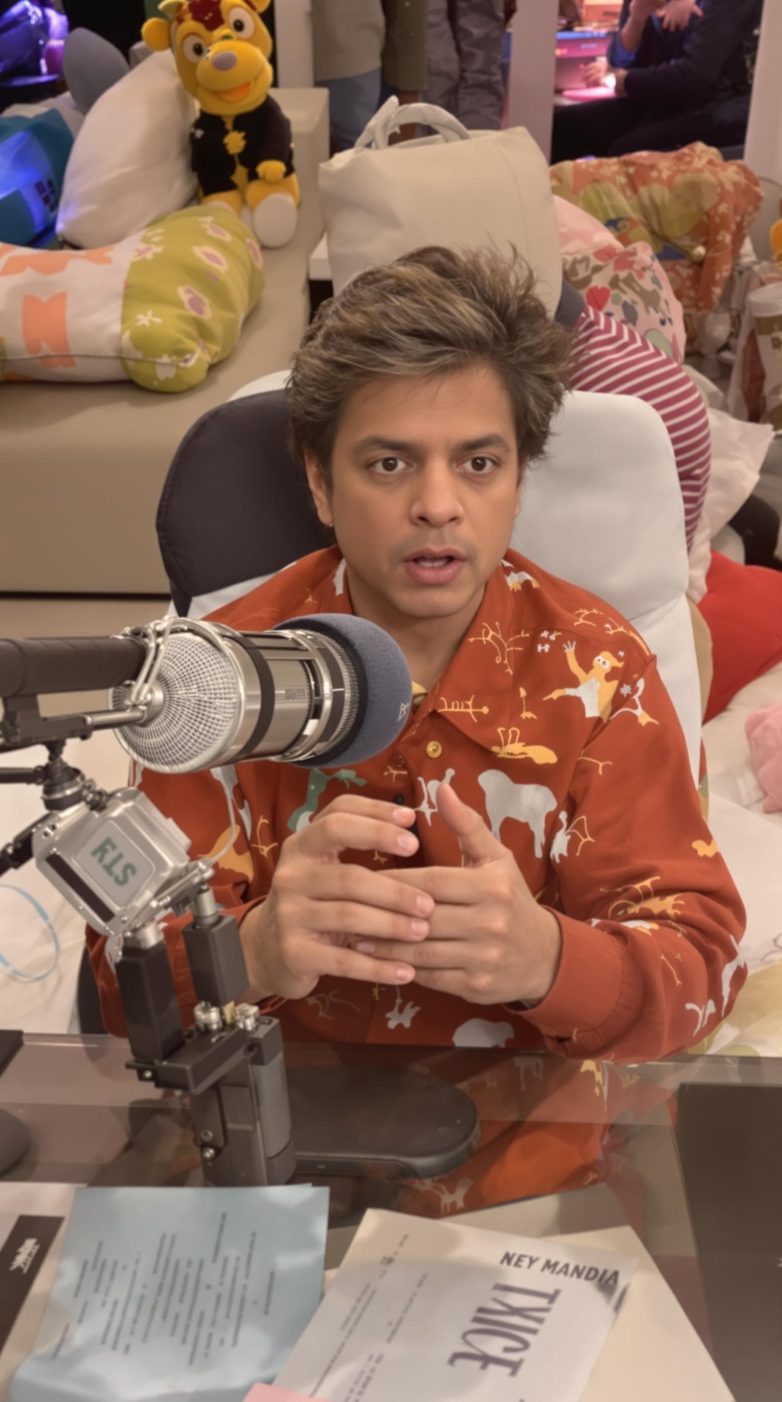 AI generated: Shahrukh Khan as a baby doing podcast