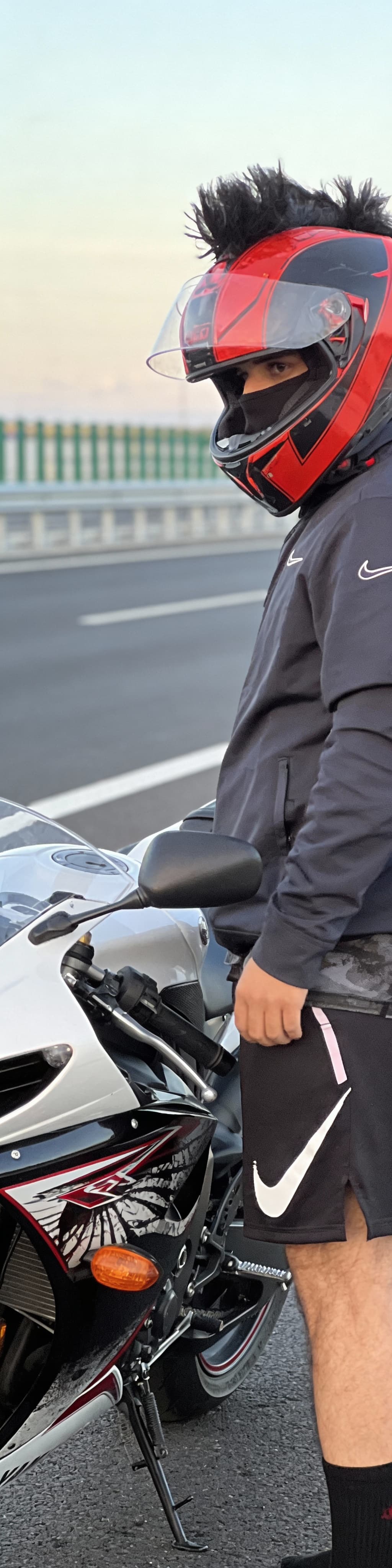 AI generated: Added me on highway standing beside that Motorcycle uploaded 