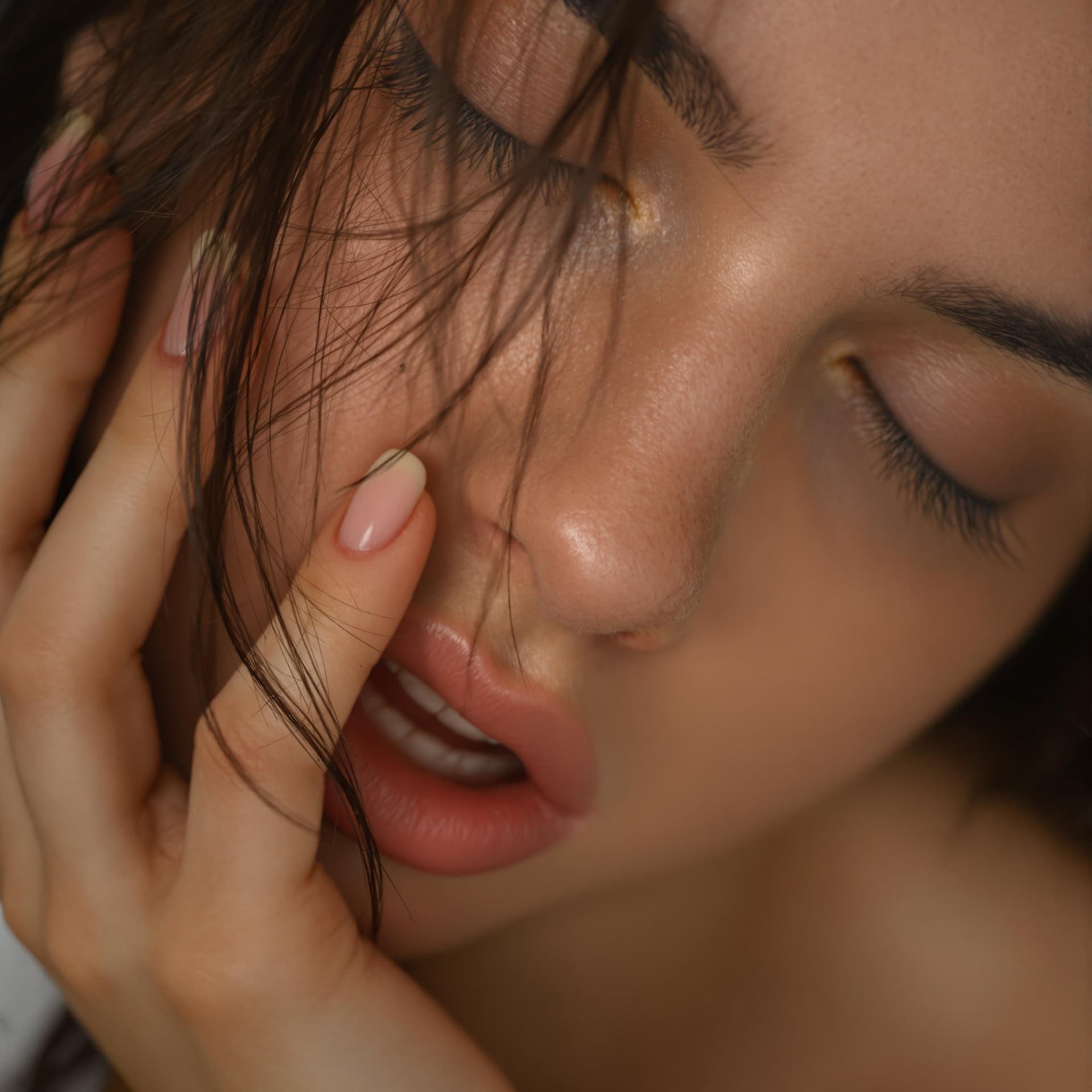 AI generated: close-up portrait of the face, 20 year old greek girl, Erotic orgasm pleasure is visible on her face