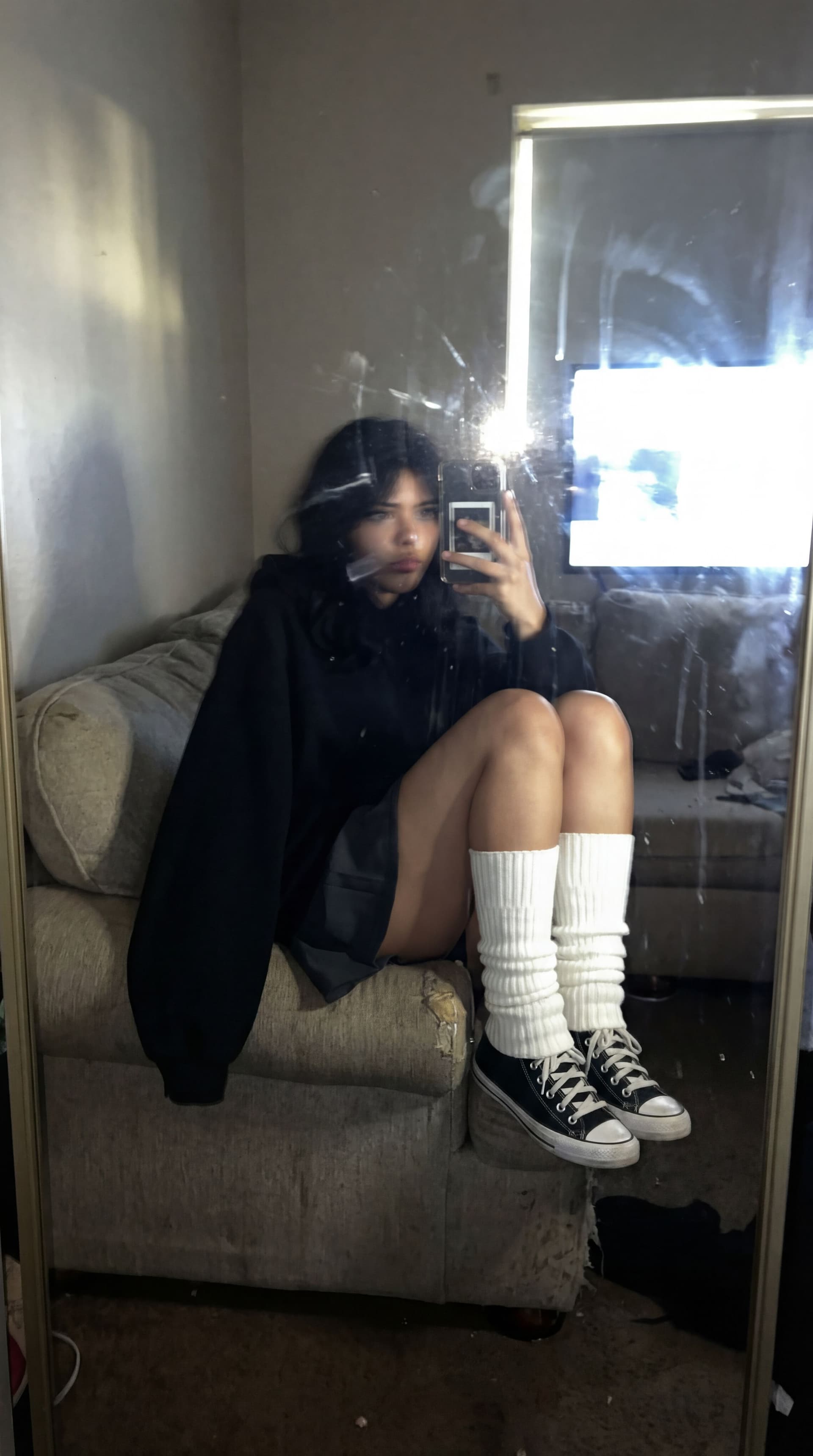 AI generated: An extremely unremarkable iPhone mirror selfie photo with no clear subject or framing—just a careles...