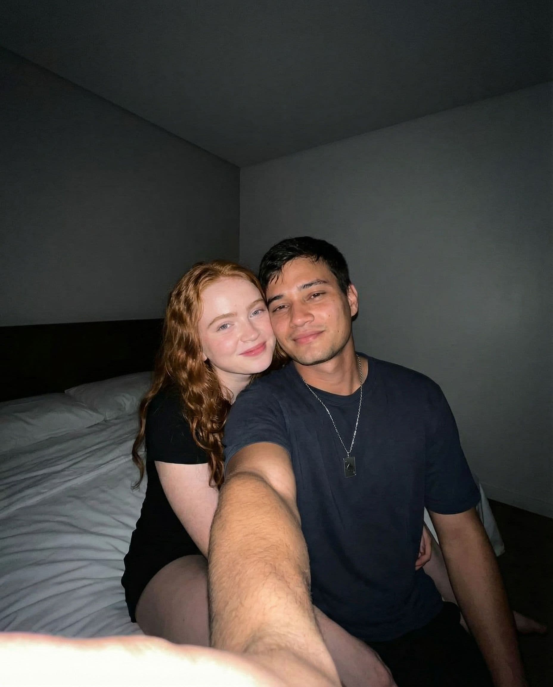 AI generated: {
"scene": {
"location": "dark room",
"furniture": {
"bed": {
"sheets": "white",
"position": "sittin...