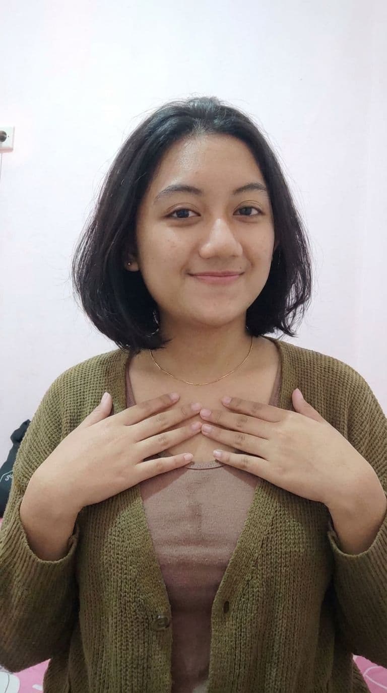 AI generated: Keep the girl outer on photo, she upper tank top opened from lower to top,
Both hands are gently cov...