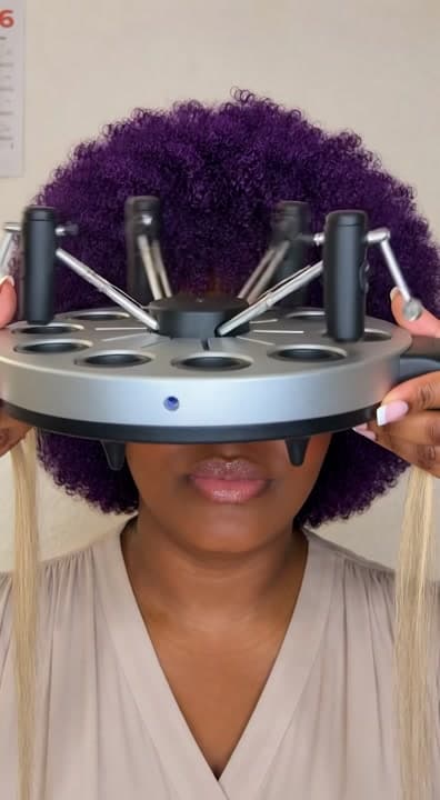 AI generated video: Using a very big automation braiding round machine on my client who have blon hair for blonde knotle...
