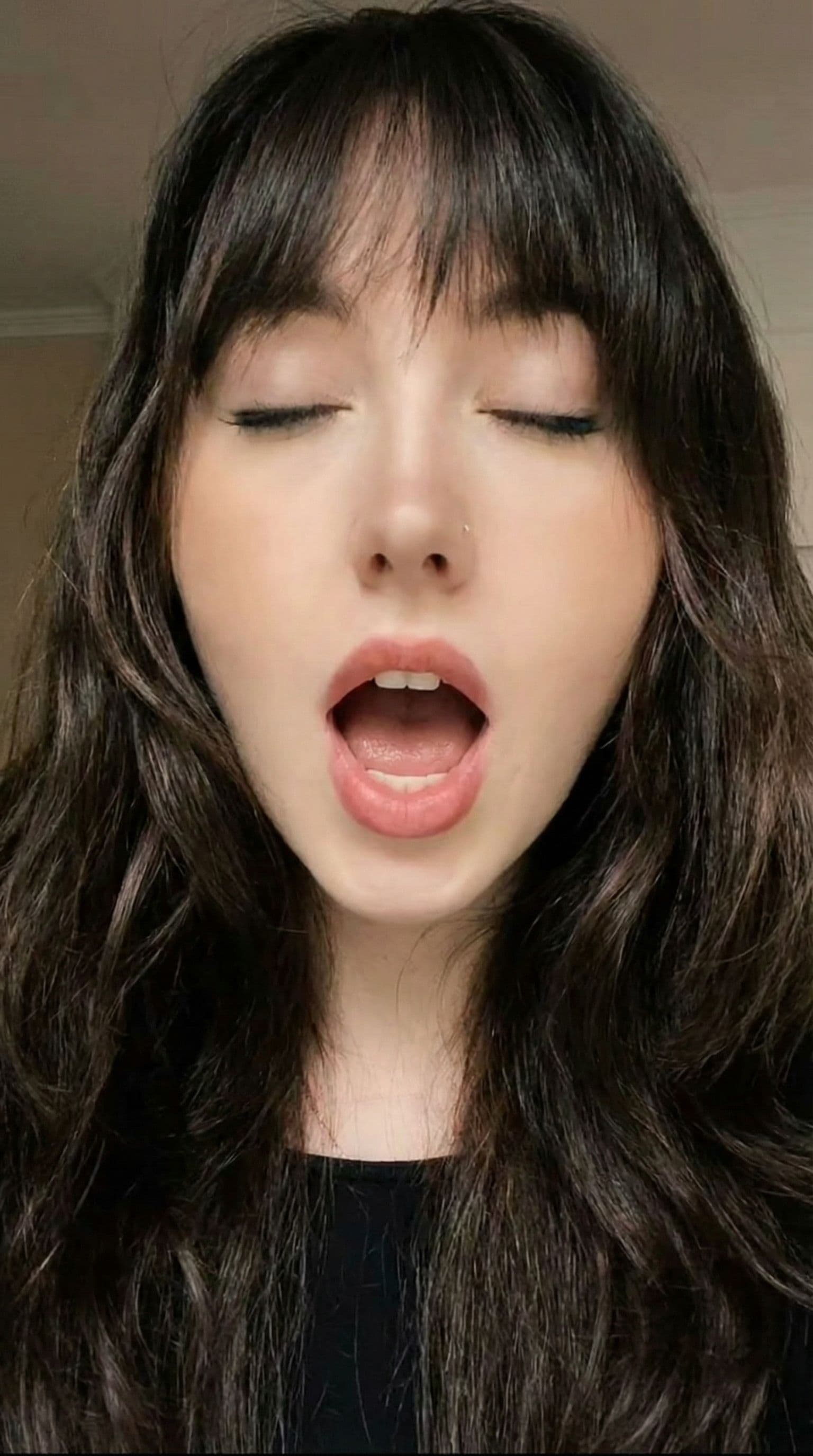 AI generated: the scene begins with the camera zooming in onto the woman's face with her mouth open wide while a m...