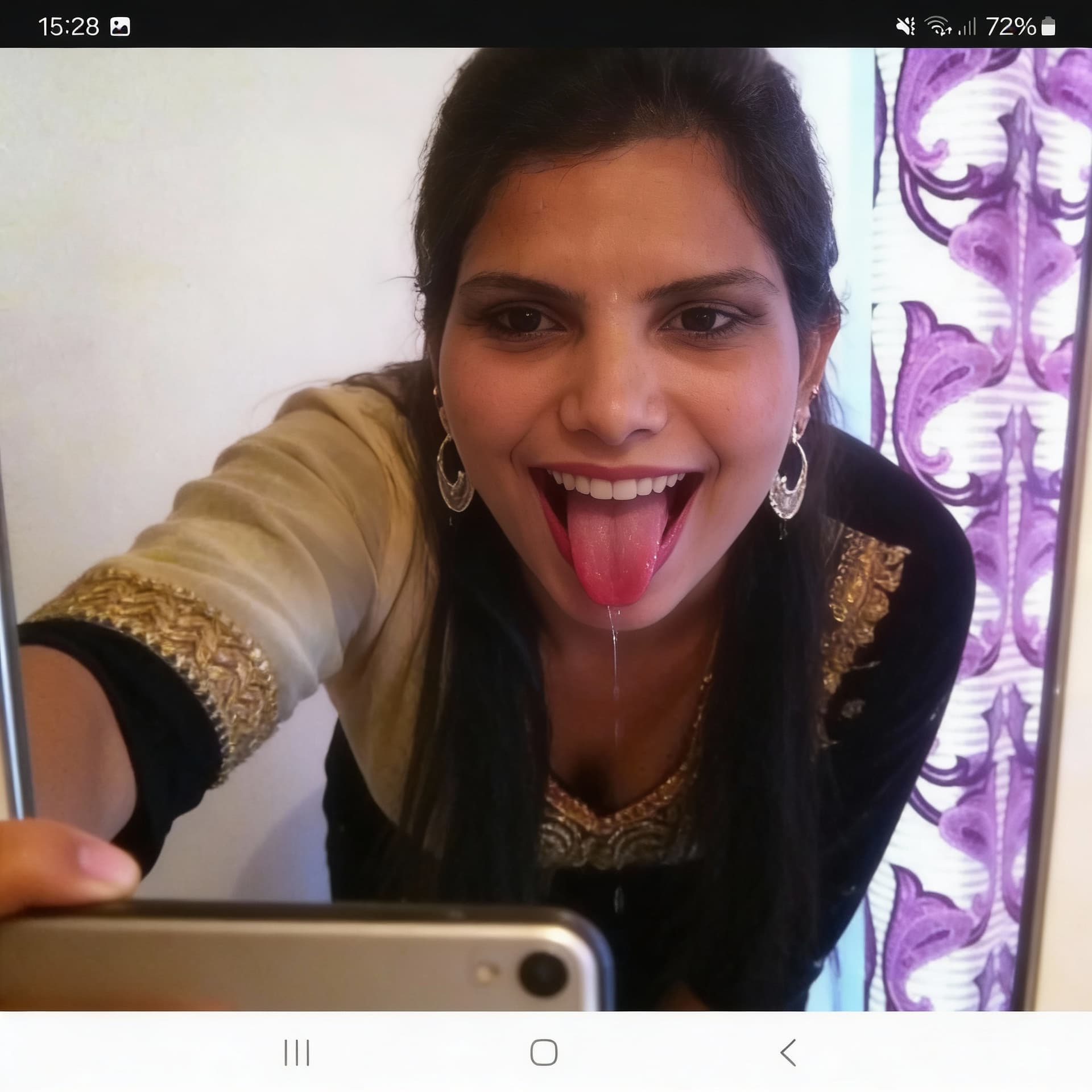 AI generated: Takes a mirror selfie while leaning over, sticking her tongue out with saliva, mouth wide open smili...