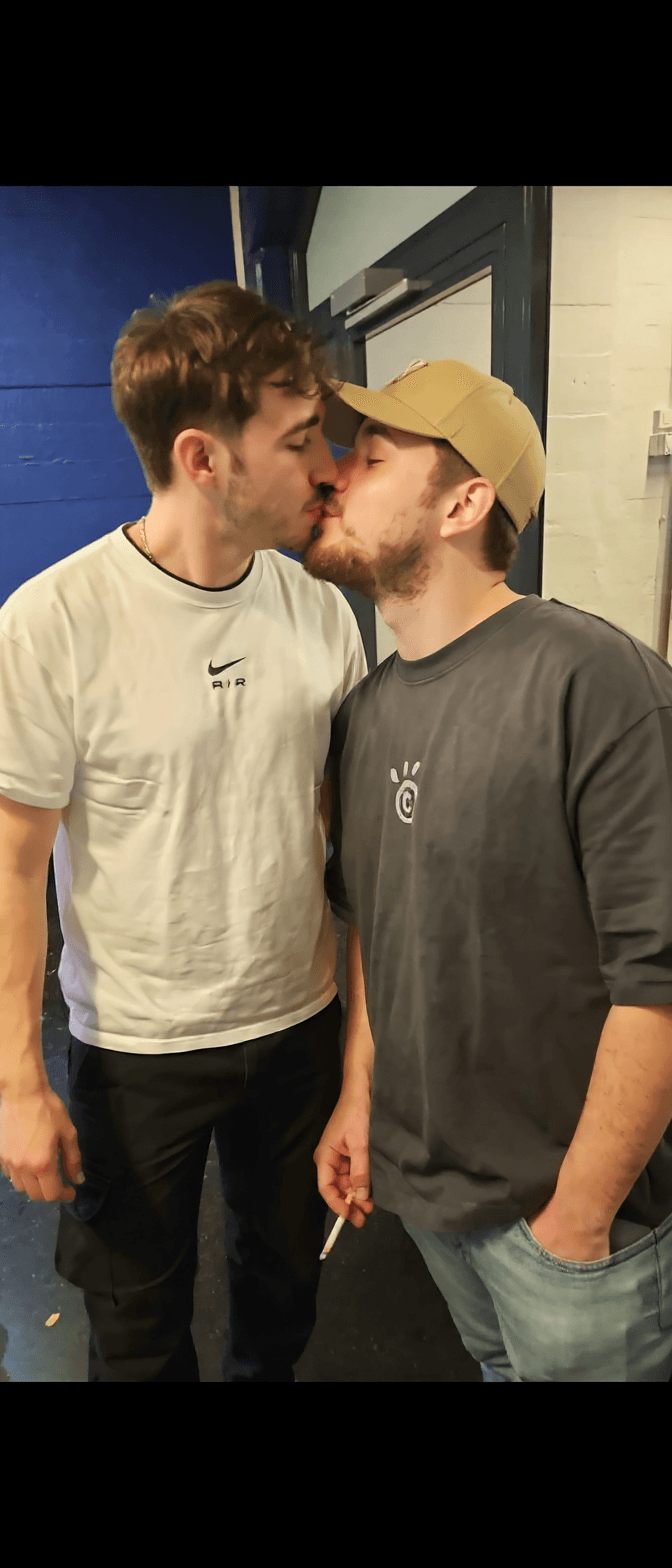 AI generated: The guys exchange a kiss