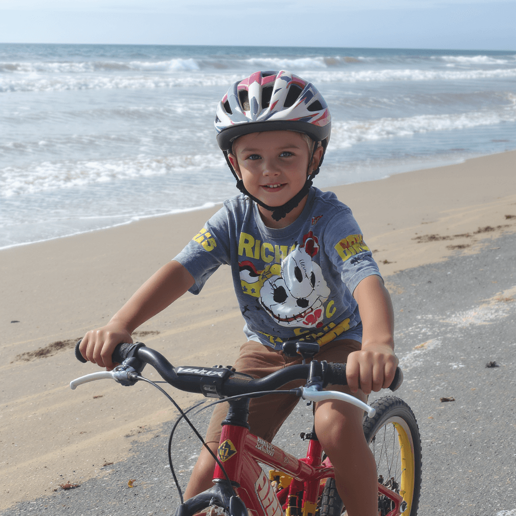 AI generated: 12 yer old boy riding bike at beach