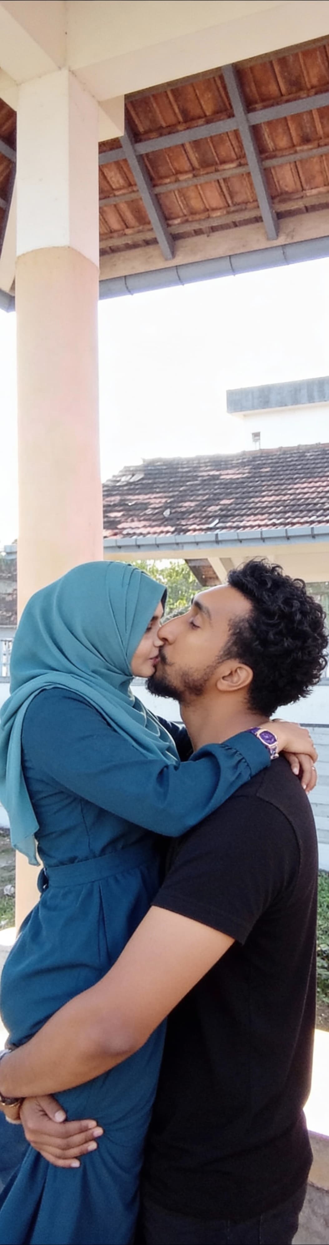 AI generated: The lifting the women on his arms and kissing the women lips 