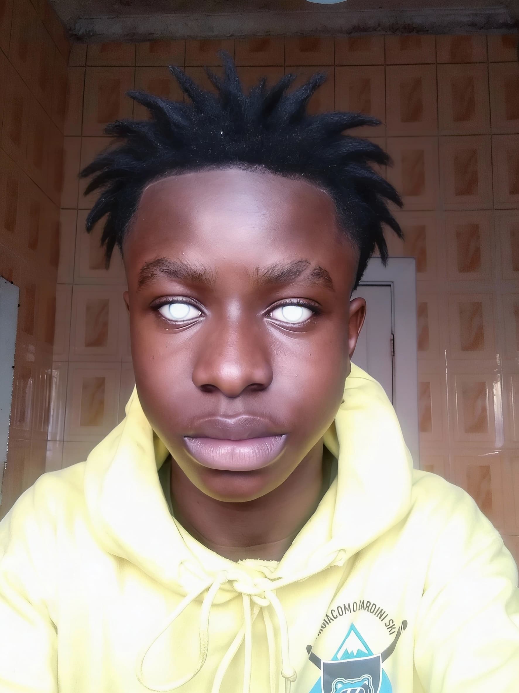 AI generated: Make him brownskin white outer eyes,freeform hair
