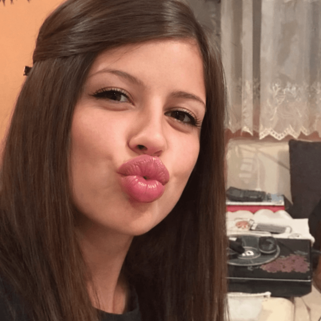 AI generated: let girl in photo make kissy face big lips