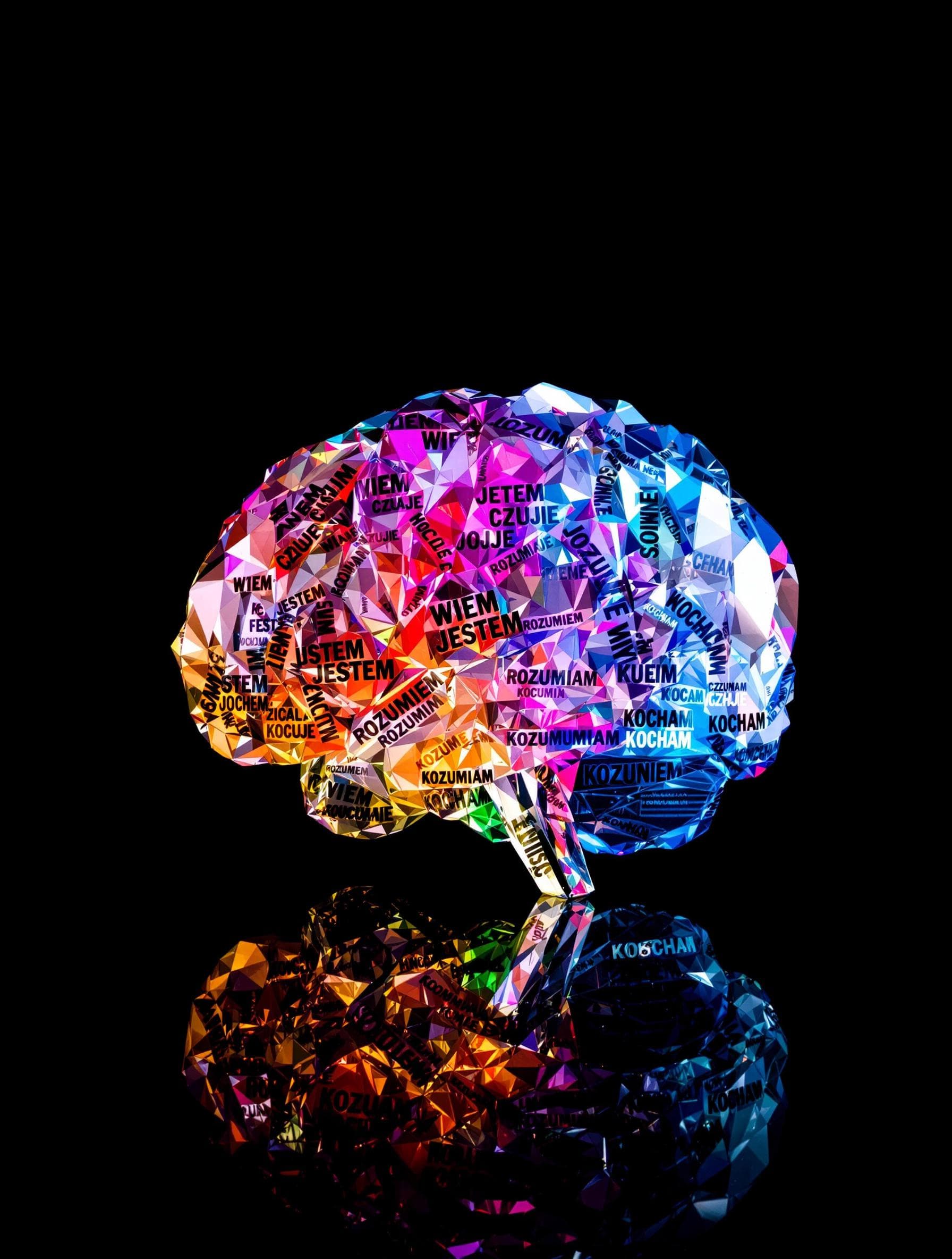 AI generated: A multi -colored crystal model of the human brain created from repeated, integrated words "WIEM" "JE...